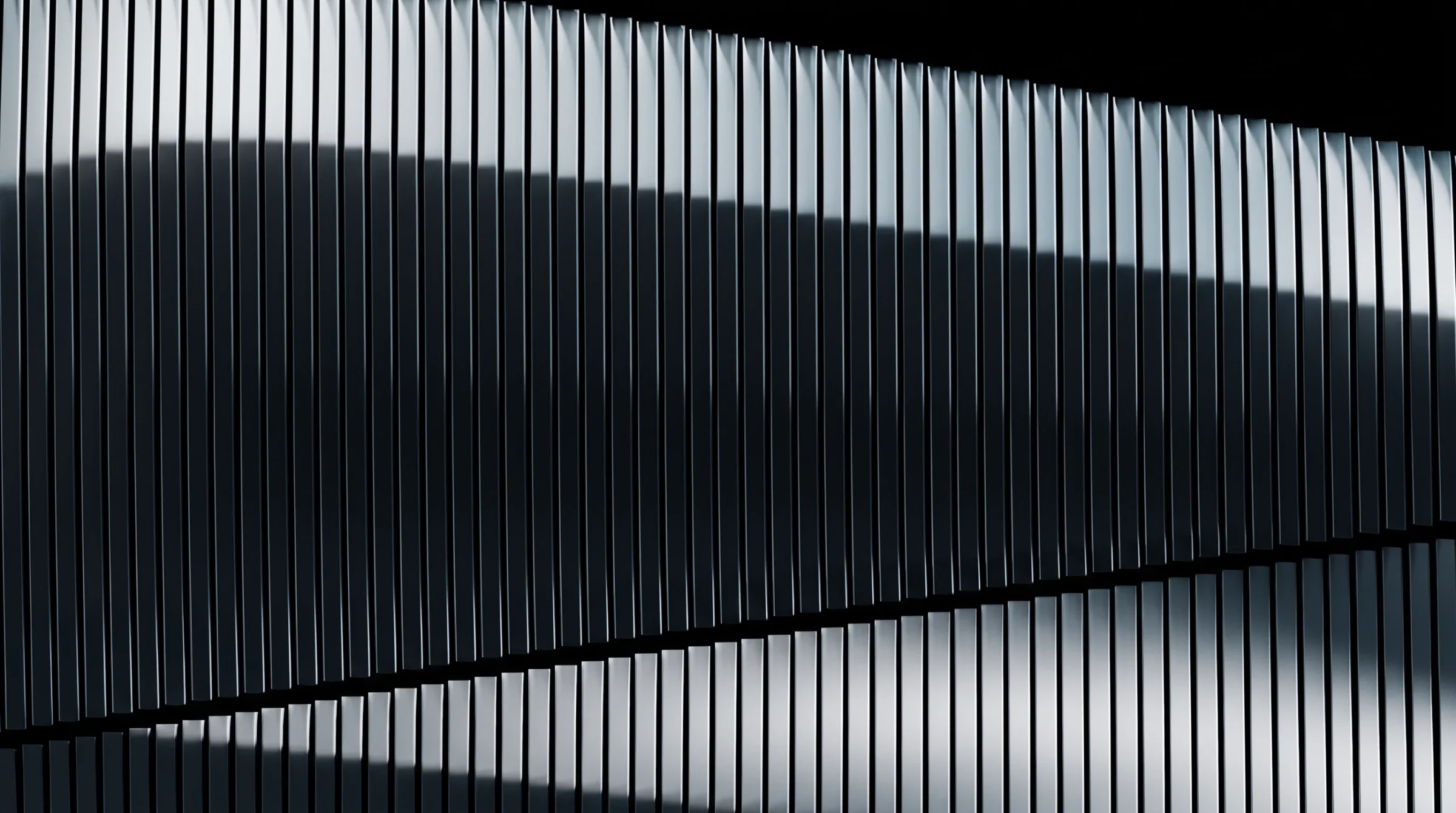 A louvred structure receding into the dark