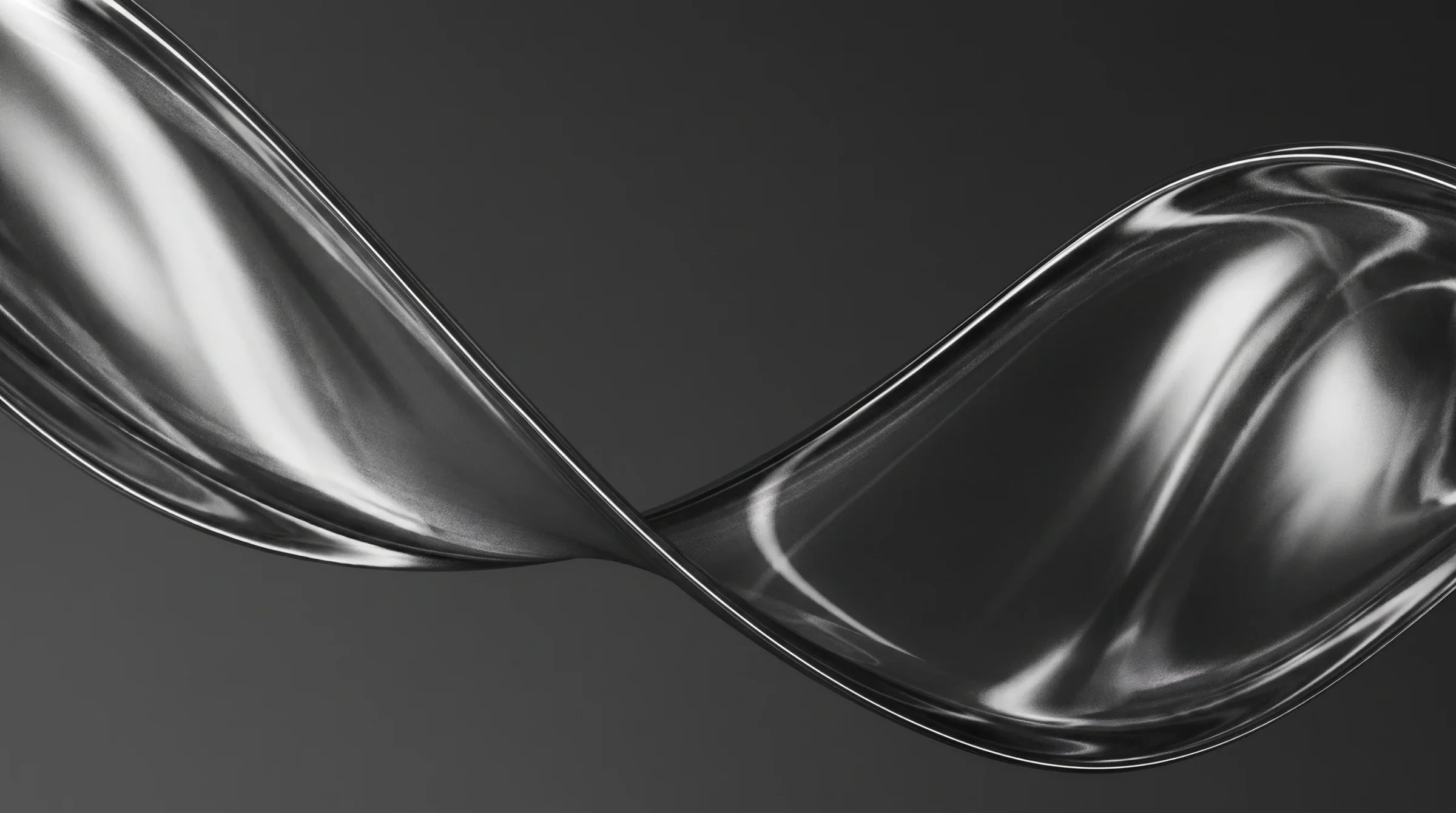 A twisted chrome form catching a single light