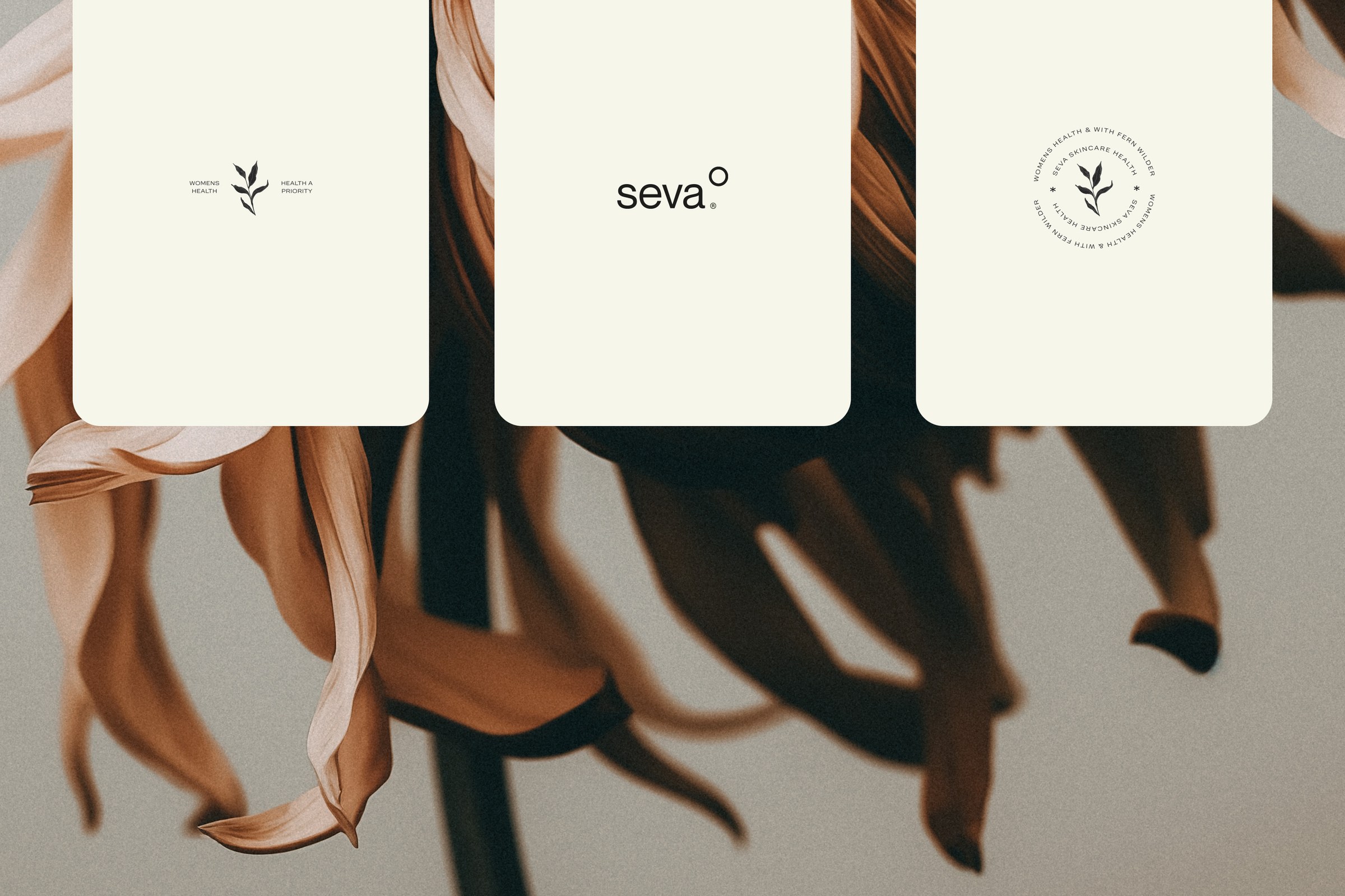 Three Seva cartons showing the wordmark, the seal and the botanical mark